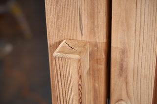 Close up of the wood grain on a sauna door handle