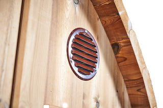 Close up of metallic mesh lined sauna vent