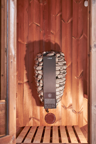 Harvia barrel heater fitted inside a finnish designed sauna