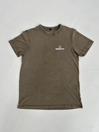 Fabric detail of acid wash t-shirt – breathable 100% cotton with subtle branding